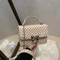 Mini sac bandoulière à pois rouges avec boucle nœud argentée et chaîne - Monogramme Kaki