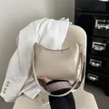 Chic cream beige half-moon shoulder bag with textured jacquard strap and gold hooks - Khaki