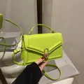 Fashionable fluorescent green mini crossbody bag with golden oval twist lock and handle - Green