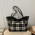 Retro black, white and yellow plaid wool tote bag with leather straps on a wooden table - Large Plaid Gray