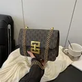 Vintage brown shoulder bag with monogram print and golden chain strap - Coffee