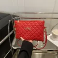 Red quilted shoulder bag with gold bow clasp in a modern lifestyle setting - Red