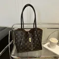 Dark brown tote bag with vintage floral pattern and elegant gold metal buckle detail - Coffee