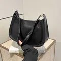 French vintage crescent underarm bag in black oil wax leather with gold zipper detail - Black