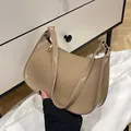 Minimalist khaki leather shoulder bag with glossy finish and gold zipper detail - Khaki