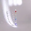 Detail of spiral suncatcher with rainbow crystal beads and large purple crystal ball prism - Multicolor Beads With Purple Ball (Swivel Ring Style)