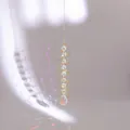 Detail of golden spiral stabilizer suncatcher with light cyan crystal beads and prism light - Gold Spiral AB Color Flat Teardrop Pendant