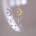 Golden moon suncatcher with crystal prisms creating rainbow reflections on wall - Moon and Crystal Ball Style (Style 2)