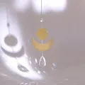 Macro detail of suncatcher showing golden crescent moon and crystal prism rainbow light - Disc Moon Teardrop Crystal Style (款式四)