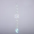 Dettaglio di un acchiappasole in cristallo con rivestimento AB, fiocco e goccia - Stile 5 (Goccia Enorme)