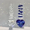 Set of 2 heart prism crystal suncatchers casting rainbow light on a soft grey background - Blue and White
