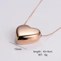 Macro shot of polished rose gold heart pendant necklace with 15mm 3D heart and snake chain - Small (15mm) / Rose Gold
