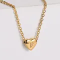 Polished 18K gold plated heart pendant necklace featuring embossed letter F detail - Letter F