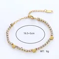 Goldenes Edelstahl-Tennisarmband mit glänzenden Kristallschmetterlingen und verstellbarer Kette - Gold