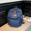 Blue denim backpack with large capacity and vintage wash finish for daily travel - Dark Blue