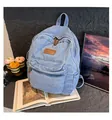Light blue washed denim backpack with vintage leather logo patch and front zipper pocket - Light Blue