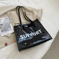 Μαύρη διαφανής τσάντα PVC με λευκό κείμενο Support και ανθεκτικούς ιμάντες ώμου - Μαύρο