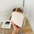 Creamy white hexagonal acrylic clutch bag with gold trim and woven handle - White