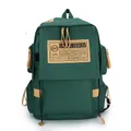 Deep green canvas backpack with khaki patch and spacious compartments for students - Green