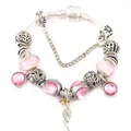 Bracciale a catena snake argento con perle rosa e ciondolo ad ala d'angelo e goccia - Rosa / 16cm