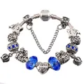Macro view of silver DIY charm bracelet with blue glass beads and heart pendant - Dark Blue / 17cm