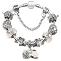 Detail of silver snake chain bracelet with MOM heart charms and pink enamel flower - 16cm / White