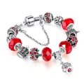Silver snake chain bracelet with vibrant red faceted beads and crown charms - 17cm / Red