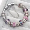 Charming floral glass beads and faceted purple crystals on silver snake chain bracelet - Purple / 16cm