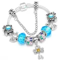 Silver plated charm bracelet with blue crystal beads and enamel ladybug floral pendant - Blue / 16cm