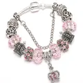 Elegant silver crown charm bracelet featuring pink faceted crystals and a safety chain - Pink / 16cm