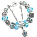 Silver crown charm bracelet with sky blue faceted crystal beads and cross pendant - Blue / 16cm