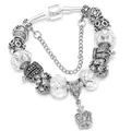 Classic silver charm bracelet featuring a crown pendant and faceted crystal beads - White / 16cm