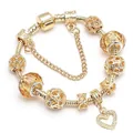 Bracelet à breloques dorées avec perles en verre champagne et pendentif en forme de cœur - Design de Cœur en Verre Champagne (Style 005)