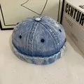Detail of vintage washed denim docker hat showing seam stitching and distressed fabric texture - M (56-58cm) / Light Blue
