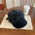 Detail of vintage washed corduroy 5-panel camper hat with high-density texture on wood table - M (56-58cm) / Black