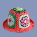 Close-up of colorful handmade crochet granny square patterns on a knit bucket hat - M (56-58cm) / Pink Daisy Hat