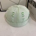 Berretto docker vintage verde menta con dettagli strappati e cuciture a contrasto - Verde