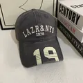 Close-up of vintage dark gray baseball cap with 3D embroidery and printed 19 on brim - M (56-58cm) / Gray