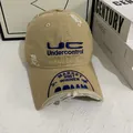 Close-up of distressed cotton baseball cap with blue UC embroidery and vintage finish - M (56-58cm) / Khaki