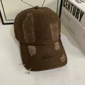 Detail of distressed cotton baseball cap with Courage embroidery and silver rings - M (56-58cm) / Coffee