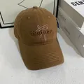 Detailed view of 3D letter embroidery and stitching on a brown cotton baseball cap - M (56-58cm) / Camel