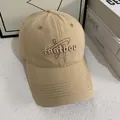 Khaki cotton baseball cap with embroidered letters and curved brim for casual street style - M (56-58cm) / Khaki