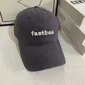 Detail of white 3D embroidery 'faatbou' on a dark grey cotton baseball cap surface - M (56-58cm) / Gray