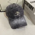Detailed macro view of vintage washed grey baseball cap with white 3D letter D embroidery - M (56-58cm) / Dark Gray