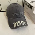 Detail of washed grey baseball cap featuring YUPI embroidery and DISQU letter print - M (56-58cm) / Gray