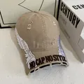 Close-up of distressed khaki baseball cap with wing embroidery and 3D textured lettering - M / Khaki