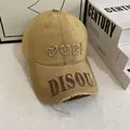 Detailed macro view of vintage distressed baseball cap with YUPI embroidery and worn brim - M (56-58cm) / Khaki
