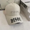 Detailed shot of beige baseball cap with YUPI embroidery and distressed brim details - M (56-58cm) / White