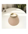 Detail of the pink straw-woven sun visor with striped ribbon trim on a white table - M (56-58cm) / Pink