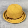 Detail of yellow knit sun hat featuring fine texture and a brown decorative bow - M(56-58cm) / Turmeric
